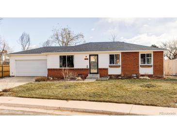 Brick ranch home with attached garage and landscaped lawn at 4612 S Coors Ct, Morrison, CO 80465