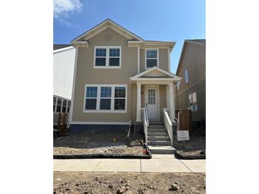 Charming two-story home with a welcoming front porch and classic design at 245 Washington St, Erie, CO 80516