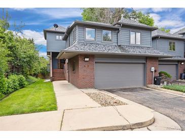 Charming two-story home with attached two-car garage and well-maintained front yard at 761 Carr St, Lakewood, CO 80214