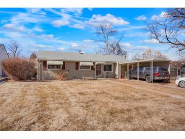 Charming single-story home with a tidy front yard and a convenient covered parking area at 3423 S Glencoe St, Denver, CO 80222