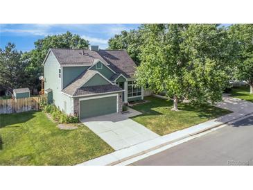 Charming two-story home with landscaped yard and attached two car garage at 19428 E Crestridge Cir, Centennial, CO 80015