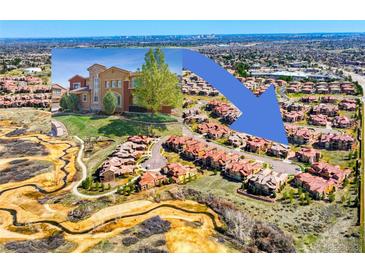 Stunning aerial view of a community featuring beautiful homes and lush green spaces at 9588 Firenze Way, Highlands Ranch, CO 80126