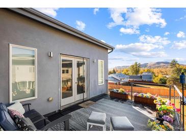 Relaxing balcony offers views of the rolling hills and beautiful Colorado skies at 1353 Quaker St, Golden, CO 80401