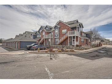 Brick building exterior with parking and landscaping at 16312 E Fremont Ave # 2, Aurora, CO 80016