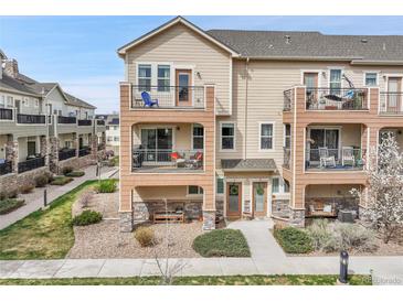 Charming townhome with multiple levels, private balconies and covered front porch at 11250 Florence St # 21A, Commerce City, CO 80640