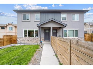 Inviting exterior of the two-story home with modern siding, stone accents, and a well-maintained front lawn at 2226 S Galapago St, Denver, CO 80223