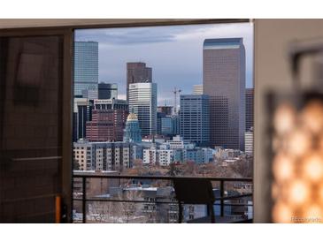 Fantastic city view featuring stunning skyscrapers and Denver's unique architectural skyline, seen through a sliding glass door at 800 N Pearl St # 1211, Denver, CO 80203