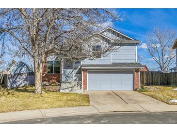 Charming two-story home featuring a well-manicured front yard and attached two-car garage at 270 N Holcomb Cir, Castle Rock, CO 80104