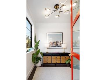 Bright entryway featuring modern lighting, accent furniture, and stylish decor at 2524 Zenobia St, Denver, CO 80212