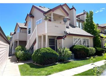 Inviting two-story townhome with well-maintained landscaping and a private balcony at 8361 S Upham Way # 209, Littleton, CO 80128