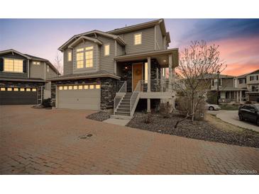 Charming two-story home featuring a two-car garage and a welcoming entrance at 8095 E 128Th Pl, Thornton, CO 80602