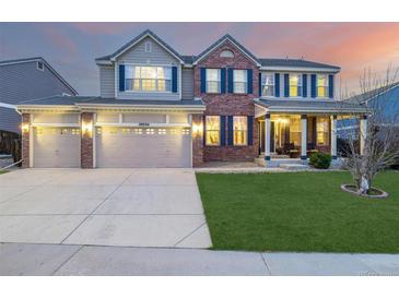 Beautiful two-story home featuring a three-car garage and well-maintained lawn at 20534 E Union Cir, Aurora, CO 80015