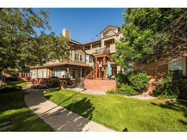 Beautiful two-story condo featuring manicured landscaping and a community courtyard at 6001 S Yosemite St # B206, Greenwood Village, CO 80111