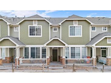 Inviting exterior of the home showcasing its well-maintained facade and front porch at 15945 E Geddes Dr # 54, Aurora, CO 80016