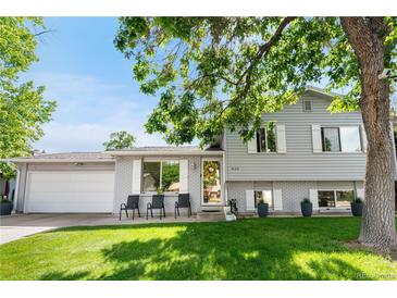 Charming two-story home with a well-manicured lawn and inviting curb appeal on a bright, sunny day at 7132 Xavier Way, Westminster, CO 80030