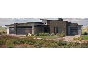 Modern two-story home with attached garage and landscaped yard at 5191 Lions Paw St, Castle Rock, CO 80104