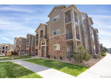 Attractive apartment building with a combination of siding and stone exterior finishes at 9227 Rolling Way # 201, Parker, CO 80134