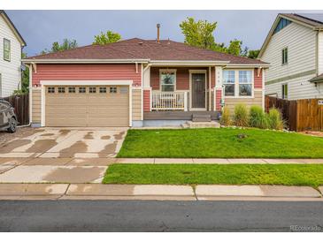 Charming single-Gathering home with a well-maintained lawn and an attached garage, perfect for suburban living at 426 N 48Th Ave, Brighton, CO 80601