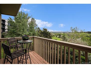 Enjoy the view from this balcony with a table and chairs, ideal for relaxation at 44 S Holman Way, Golden, CO 80401