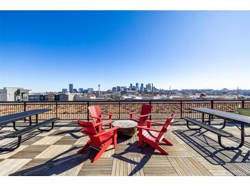 Enjoy city views from this rooftop deck with outdoor seating and picnic tables at 2650 Front View # 205, Denver, CO 80211