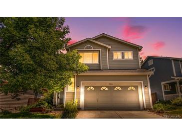 Charming two-story home with a well-maintained lawn and inviting curb appeal at 10262 Spotted Owl Ave, Highlands Ranch, CO 80129