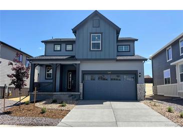 Charming two-story home with a covered porch, two-car garage and a modern design at 11016 Snowdon St, Parker, CO 80134