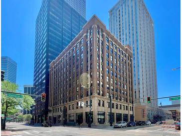 Classic brick building nestled in the city center surrounded by modern buildings and vibrant street life at 444 17Th St # 301, Denver, CO 80202