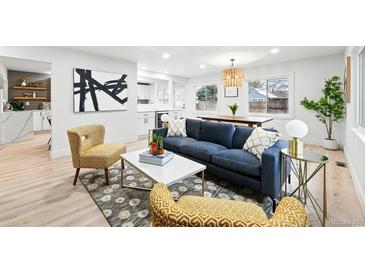 Bright living room featuring modern decor, stylish furnishings, and an open layout at 3067 Robin Way, Denver, CO 80222