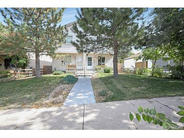 Charming duplex with a well-maintained front yard and inviting entrance at 4722 S Bannock St, Englewood, CO 80110