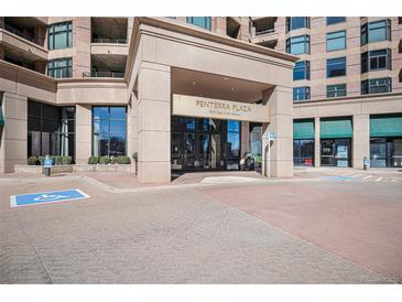 Penterra Plaza condo building entrance features accessible access and well-maintained landscaping at 8100 E. Union Ave # 409, Denver, CO 80237