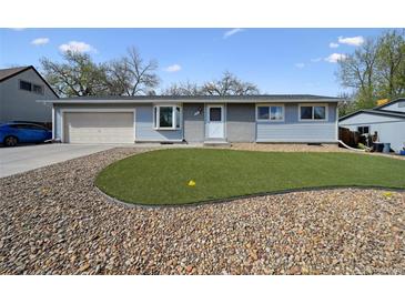 Charming home featuring a well maintained front yard with rock landscaping at 8731 W 89Th Pl, Broomfield, CO 80021