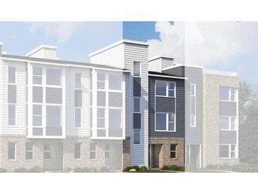 New construction townhome with modern design, gray siding, stone accents, and large windows at 14269 Currant St, Broomfield, CO 80020
