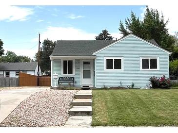 Charming single-story home with light blue siding, a well-manicured lawn, and inviting curb appeal at 2285 S Knox Ct, Denver, CO 80219