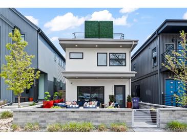 Modern two-story home featuring a sleek design and a welcoming patio area, plus a rooftop terrace at 3540 Pecos St, Denver, CO 80211