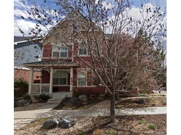 Charming two-story home with a cozy front porch and inviting curb appeal at 2502 Alton St, Denver, CO 80238