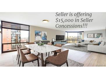 Bright dining area with marble table and modern chairs, offering city views at 1625 Larimer St # 1001, Denver, CO 80202