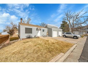 Charming single-Gathering home featuring an attached two-car garage and well-kept front yard at 16403 E Radcliff Pl # A, Aurora, CO 80015