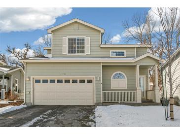 Two-story house with attached garage and snowy front yard at 21792 Silver Meadow Ln, Parker, CO 80138