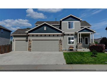 Charming two-story home with well-manicured lawn and a spacious three-car garage at 9046 Sandpiper Dr, Frederick, CO 80504