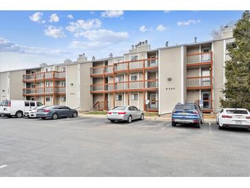 Apartment building with multiple units and balconies on each level plus plentiful parking at 8460 Decatur St # 138, Westminster, CO 80031