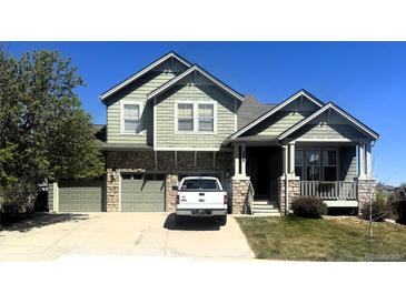 Charming two-story home featuring a two-car garage and inviting front porch at 3935 Broadview Pl, Castle Rock, CO 80109