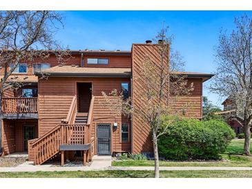 Charming two-story townhome featuring a wood exterior, well-manicured lawn, and an inviting entrance at 540 S Forest St # 5-204, Denver, CO 80246