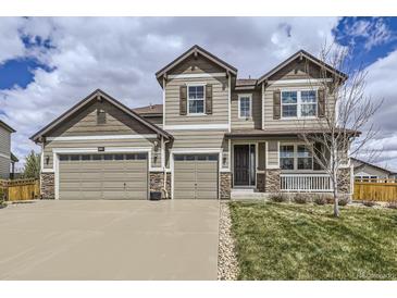 Charming two-story home with a three-car garage and stone accents at 3508 Silverado Cir, Frederick, CO 80516