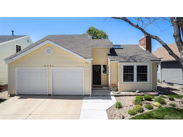 Charming single-Gathering home with a two-car garage and well-maintained landscaping under a clear blue sky at 8281 Johnson St, Arvada, CO 80005