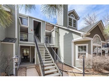Inviting condo exterior features a well-maintained facade, landscaped grounds, and a welcoming staircase leading to the entrance at 6776 S Ivy St # B5, Centennial, CO 80112