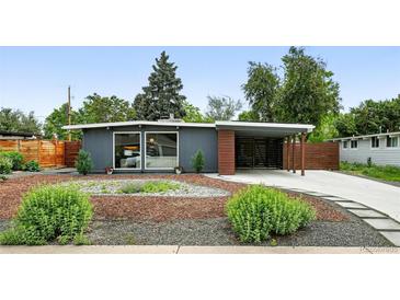 Charming single-story home featuring a well-maintained yard and unique carport at 1440 S Clermont St, Denver, CO 80222
