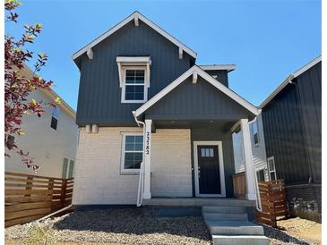Charming two-story home featuring a stylish front door and modern architectural details at 23782 E 33Rd Pl, Aurora, CO 80019
