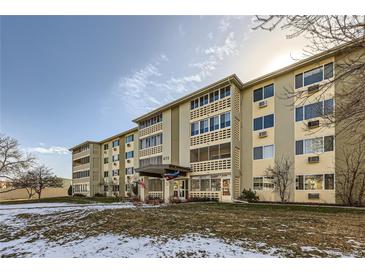 Exterior view of a multi-story apartment building with landscaping at 675 S Alton Way # 7A, Denver, CO 80247