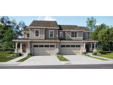 Charming duplex with attached garages and professionally landscaped front lawns at 6739 Juniper Dr, Thornton, CO 80602