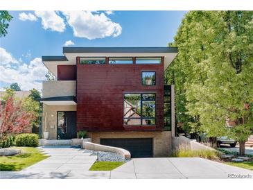 Modern two-story home with a unique design and beautiful landscaping creating great curb appeal at 421 Dexter St, Denver, CO 80220